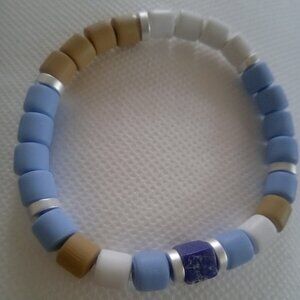 Bracelet...stretch bracelet, midnight blue cube center bead...7 1/2 inches